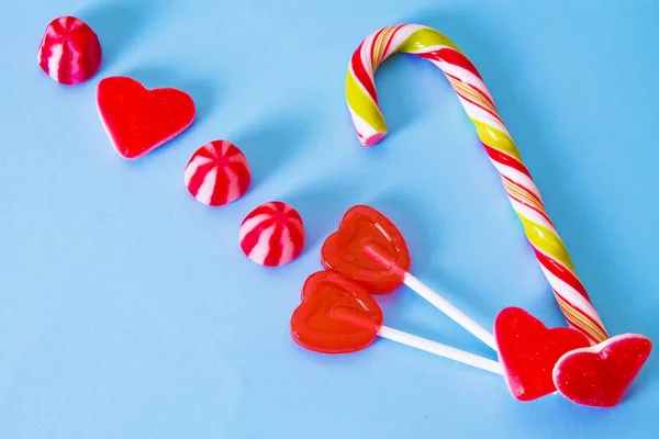 valentines greeting with heart candies and lollipops