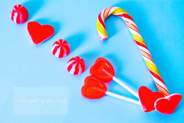 valentines greeting with heart candies and lollipops