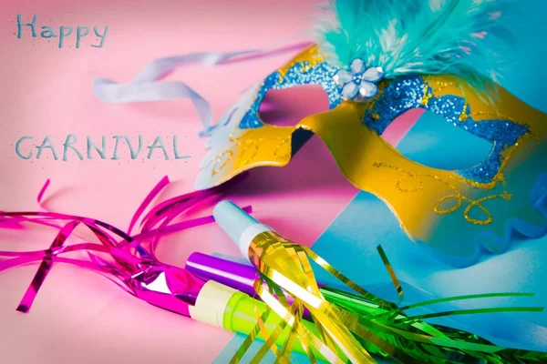 Carnival party. carnival mask and party hat on pink and blue background