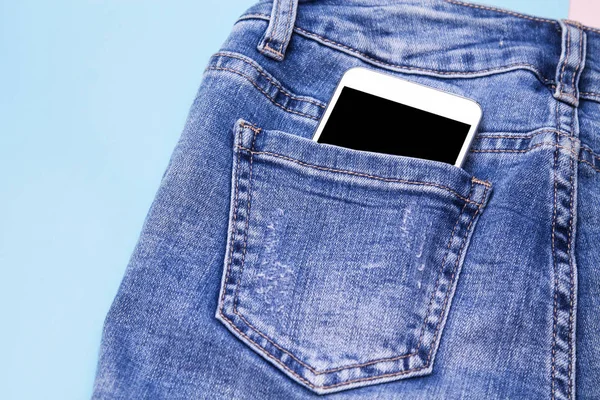 back pocket of jeans with mobile phone