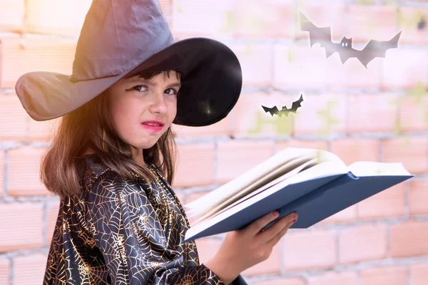 witch with book and bats making spells