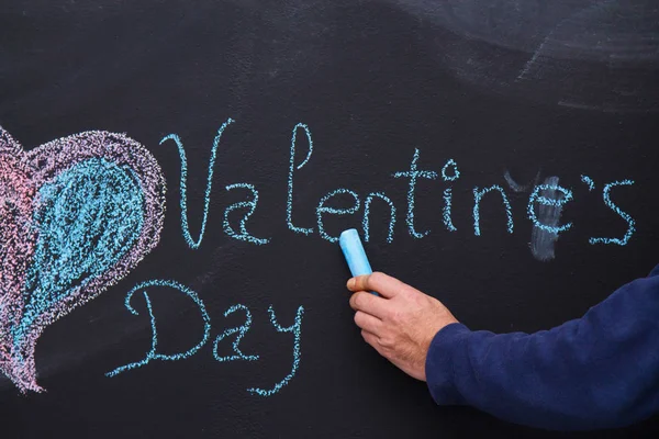 colorful heart drawing on blackboard and valentines text