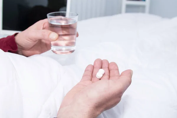 Sick Man Bed Holding Glass Water Pill — Stock Photo, Image