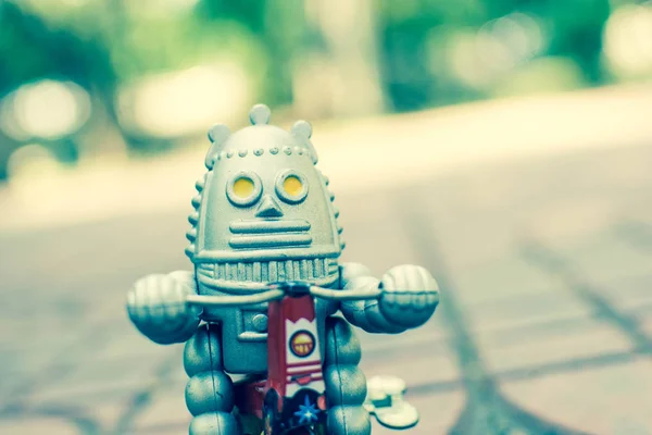 Retro robot toy, vintage color style, vintage tone background.