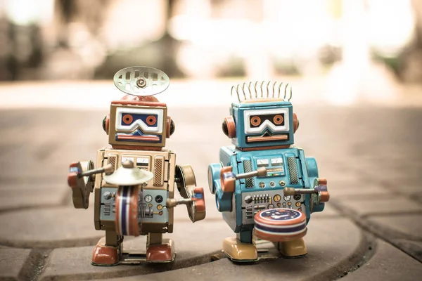 Retro robot toy, vintage color style, vintage tone background.