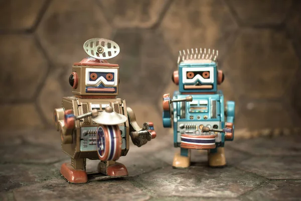 Old robot toy, vintage color style, vintage tone background.