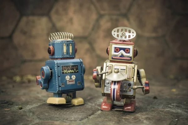 Old robot toy, vintage color style, vintage tone background.