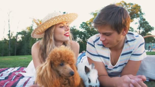 Happy couple with dog and rabbit — Stock Video
