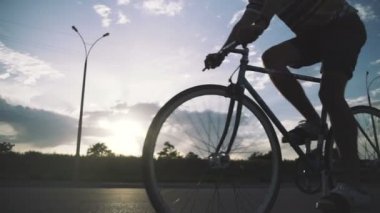 man riding fixie bike