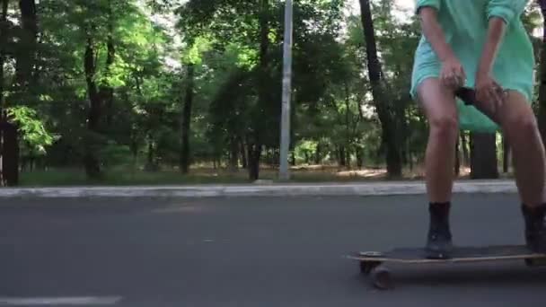 Hipster woman riding longboard — Stock Video