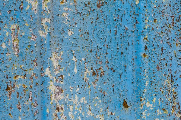 peeling paint on metal close-up with copy space. Rough texture with peeling paint.