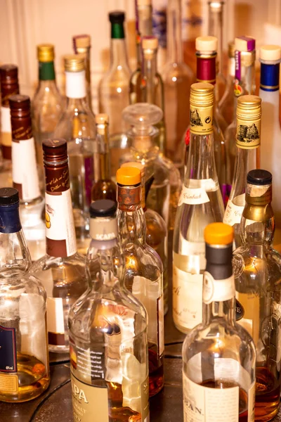 Several bottles of spirits on one table - Stock-foto