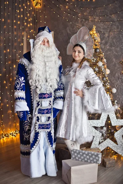 Portrait leading to the feast in Christmas costumes against t — стоковое фото