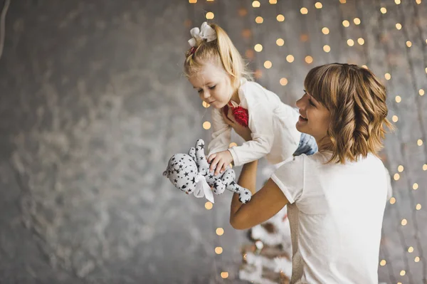 A happy child on hands at mother 7200. — Stock Photo, Image