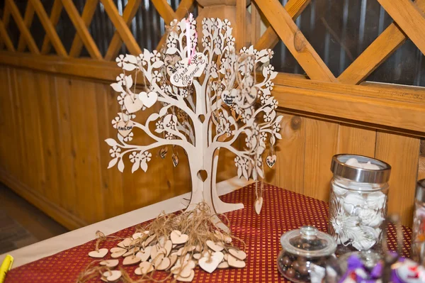 Family tree cut out of plywood with your name on the slips of pa — Stock Photo, Image