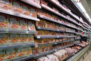 Meat, Supermarket, Butcher. Packets Of Meat At The Supermarket. Meat Aisle In Supermarket. Packaged Meats In Supermarket Refrigerated Section. Bacon, Turkey, Chicken, Steak- Dubai Uae December 2019 clipart