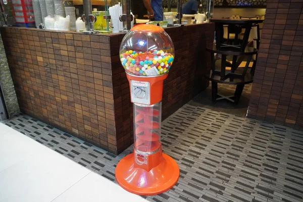 Colorful bubble gum in Coin operated gumball machine. Carousel Gumball Machine Bank kept outside a shop. - Dubai UAE January 2020 — 스톡 사진