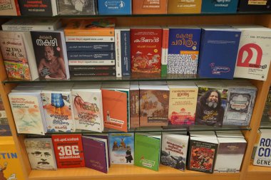 A set of Malayalam novels displayed in a book store. A shelf full of old and new Malayalam books - Kochi, Kerala: 18 February 2020