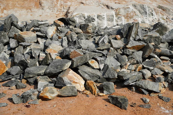 Pile Of Rocks I.E. Lithium Mining And Natural Resources Like Limestone Mining In Quarry. Natural Zeolite Rocks Are Excavated With Deforestation In Background.