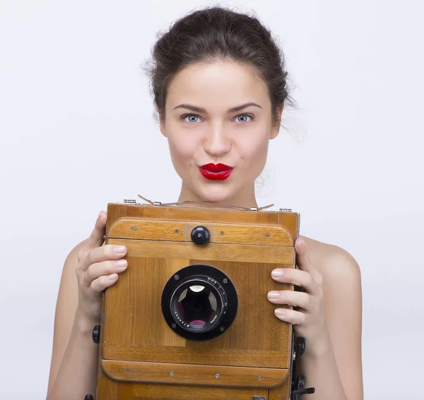 Belle fille avec caméra antique Photo De Stock