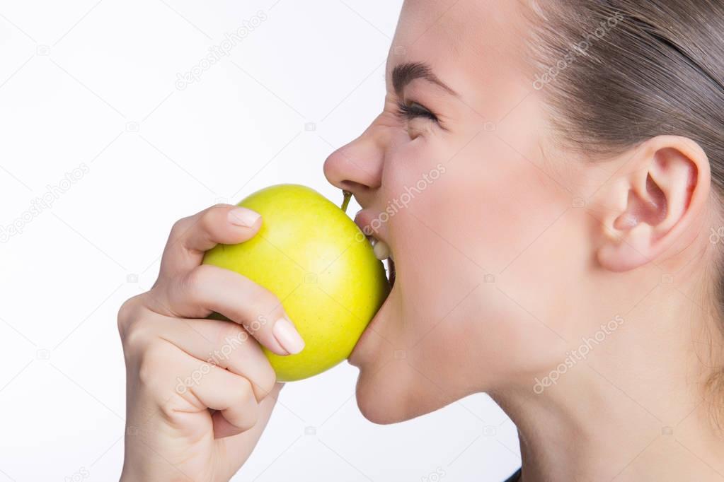 Girl bites apple