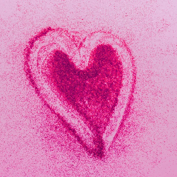 Corazón rojo símbolo del amor de los destellos de fondo rosa. Concepto de cosméticos del día de San Valentín. Espacio de copia marco cuadrado . —  Fotos de Stock