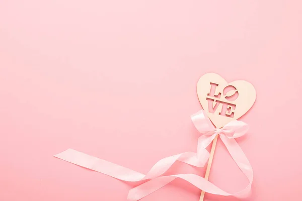 Heart made of natural material photo props with text love on a pink background. Valentines day wedding concept. — 스톡 사진