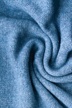 Duvar kağıtları ve arka planlar için modaya uygun maviyle örülmüş doku arka planı. Ev yapımı örgü..