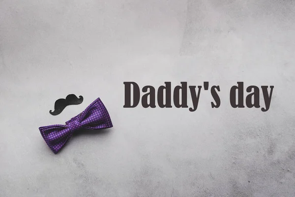 Male tie butterfly black mustache photo props text Pap day on gray background. The concept of mens holiday. Flat layout — Stock Photo, Image