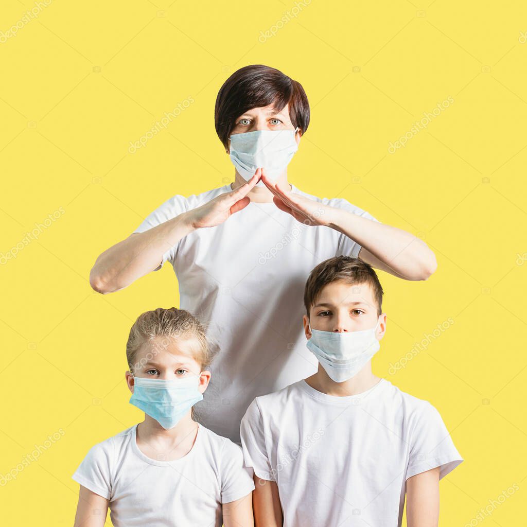 Woman children boy girl in medical masks for protection against coronovirus disease. Concept for stopping the Covid 19