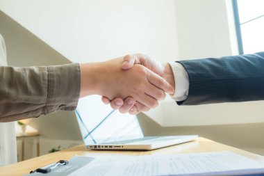 Successful Handshake in Presenting Resume for Work in the Compan