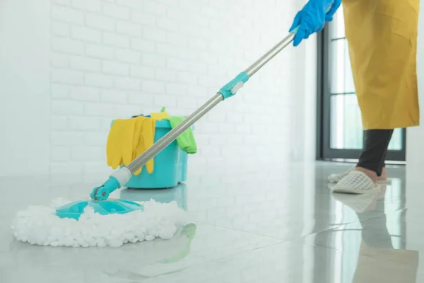 The cleaning staff use mops on the surface and use cleaning agents, which are used to kill germs and viruses.