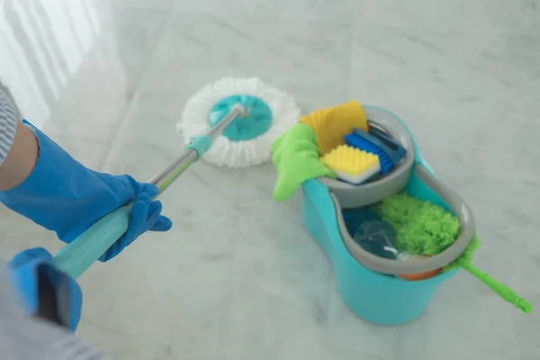 The cleaning staff use mops on the surface and use cleaning agents, which are used to kill germs and viruses.