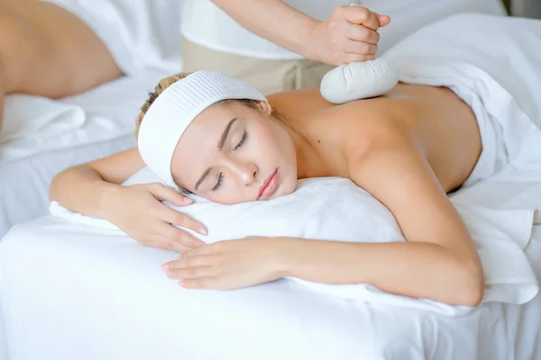 Young Beautiful Girl Enjoy Massage Herbal Ball Her Back Spa — Stock Photo, Image