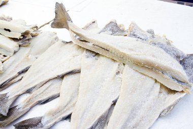 Dried and salted cod fish. clipart