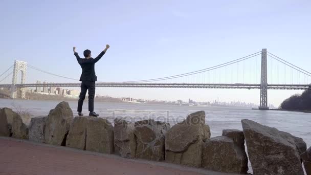 Man standing outdoors with hands up — Stock Video