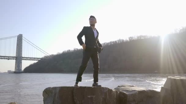 Man standing outdoors near the river — Stock Video