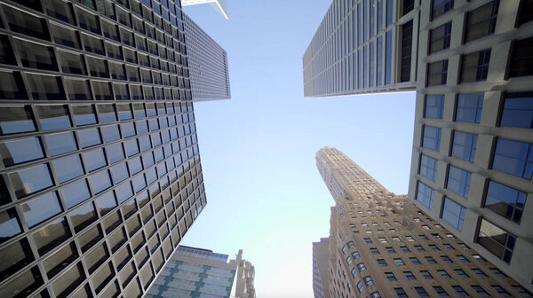 Bottom view shot of skyscrapers and blue sky