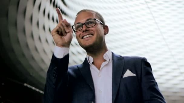 Excited young businessman in suit gesticulating — Stock Video