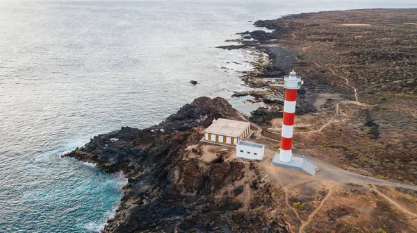 Punta Abona lighthouse. Landscape overlooking the ocean. Sunset. The water is shiny. Aerial. Tenerife Island, Spain — Stock Photo, Image
