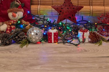 christmas ornaments over wood, gifts