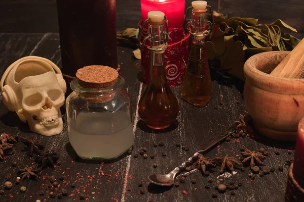 potion of natural herbs for black magic with candles