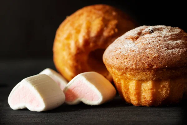 Two Baked Muffins Powdered Sugar White Heart Shaped Pastille Close — Stock Photo, Image