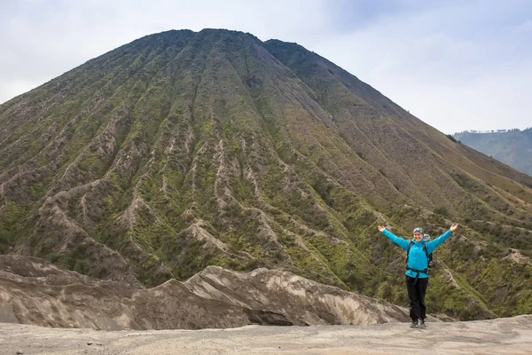 Hiking woman on top happy and celebrating success. Female hiker on top of the world cheering in winning gesture having reached summit of mountain