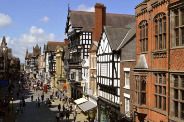 Tourists on Eastgate street in Chester clipart