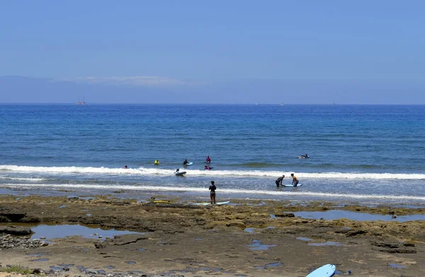 Playa De Las Americas beach surfers — Stock Photo, Image