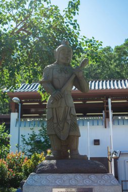 Sculpture of Chinese god with animal Zodiac near Tian Tan or the
