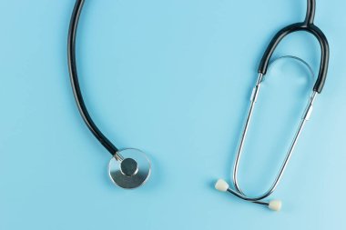 Stethoscope on blue background.  Healthcare and Health Insurance
