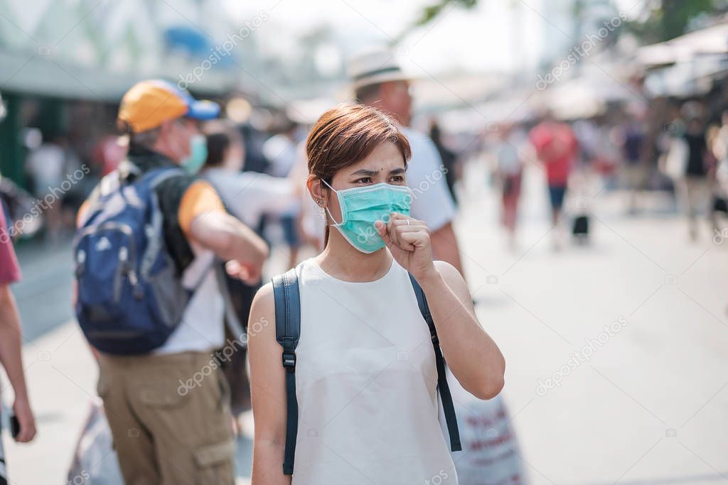 young Asian woman wearing protection mask against Novel coronavi