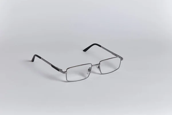 Glasses Silver Frame Located Diagonally Close Isolated White Background — Stock Photo, Image